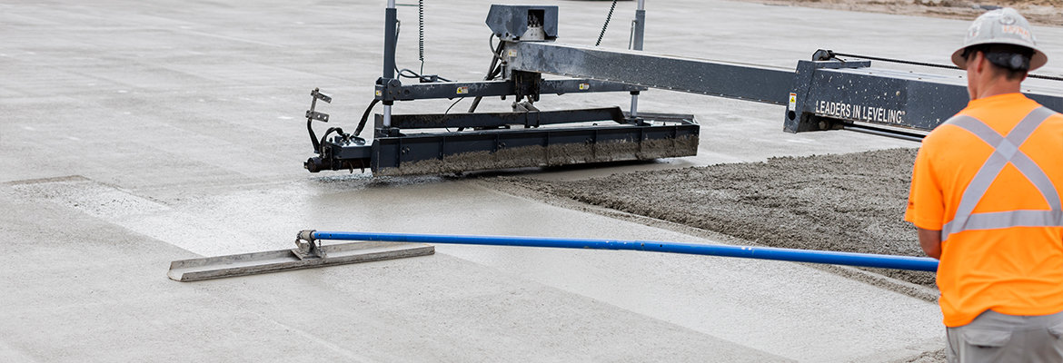 BNE Concrete Floors worker smoothing concrete floor for finishing